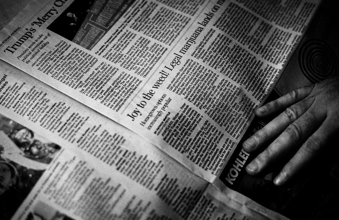 person reading newspaper